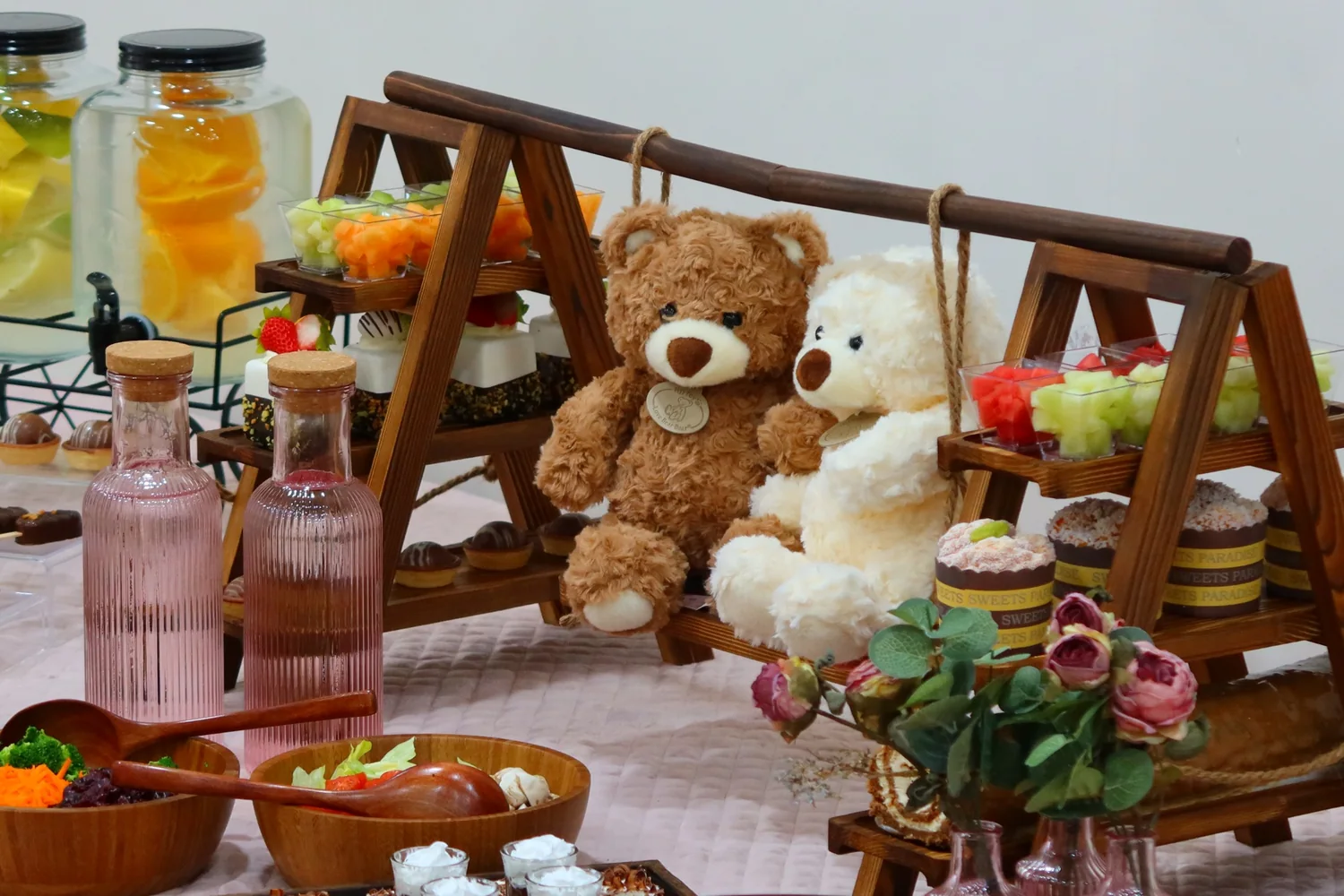 Teddy bear themed dessert display with wooden swing shelving